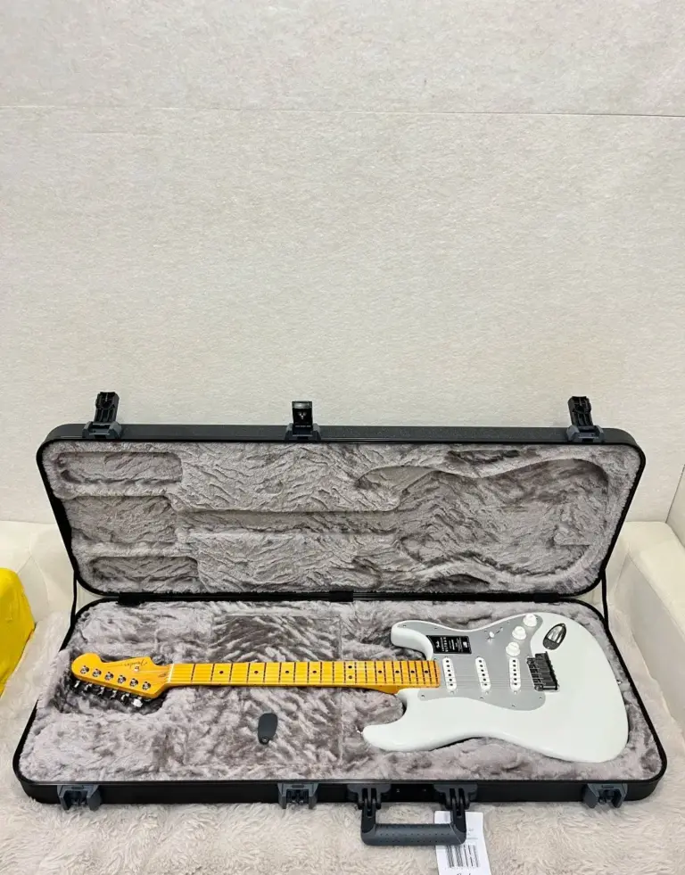 White Fender Stratocaster in its case