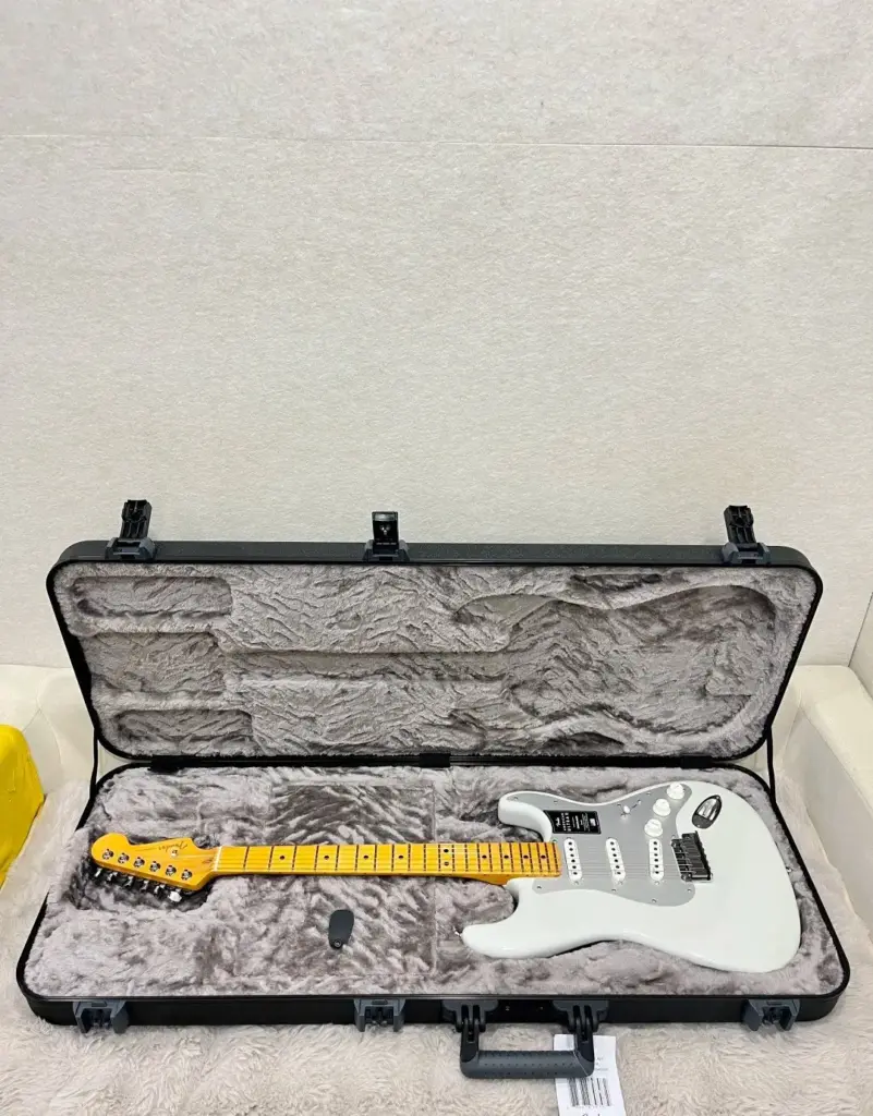 White Fender Stratocaster in its case