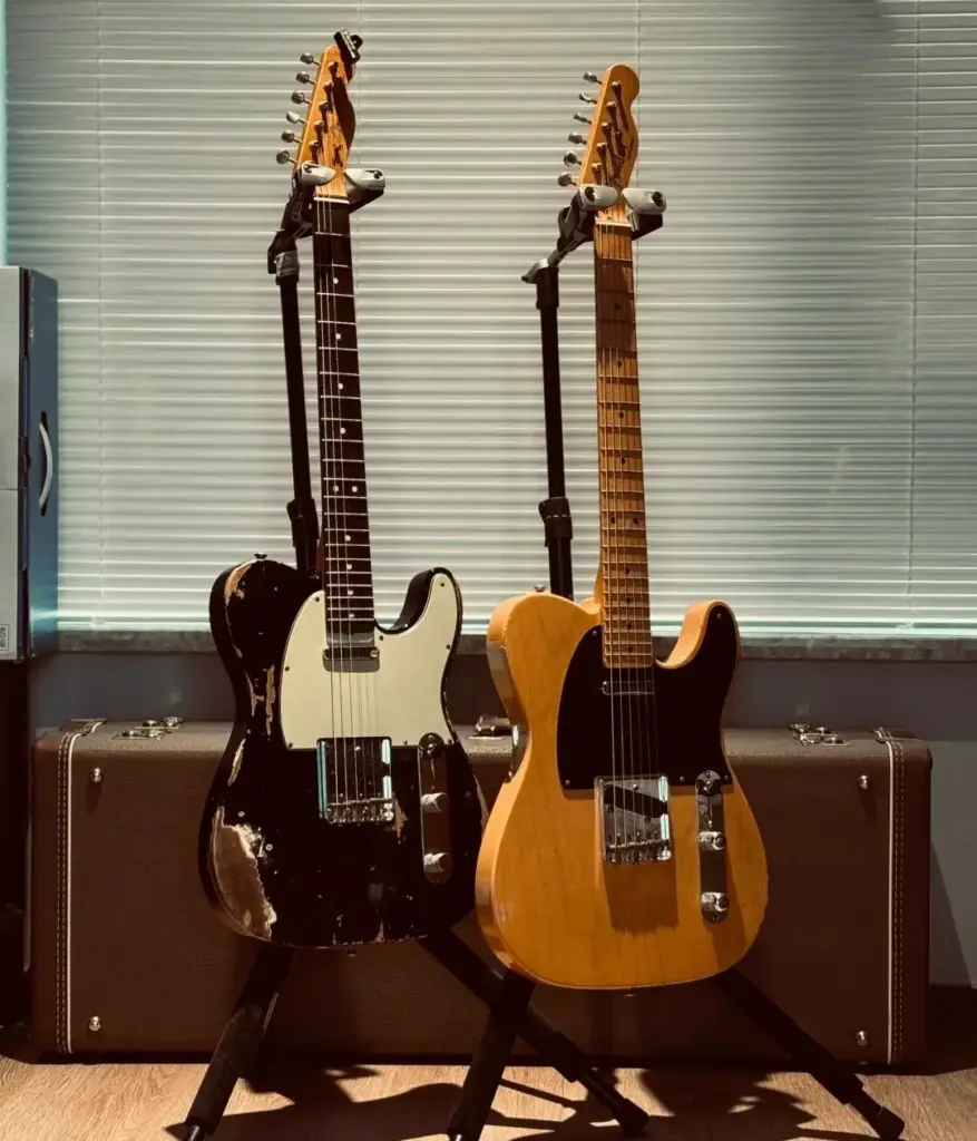 Two vintage Fender Telecasters on stands