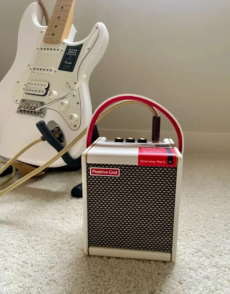 Positive Grid Spark mini amp with a white Stratocaster