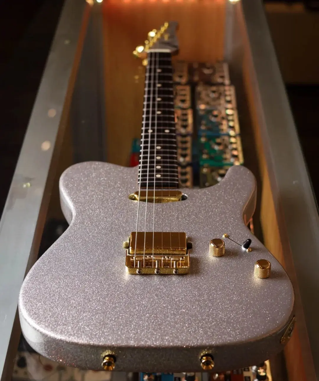Electric guitar with a silver sparkle finish